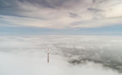 TV tower with cloudy and foggy sky-stock-foto
