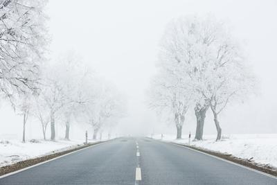 winter warning sign with snow-stock-photo