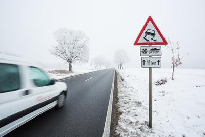 Fast moving van with snowy road-stock-photo