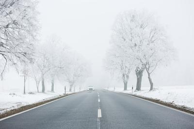 winter warning sign with snow-stock-photo