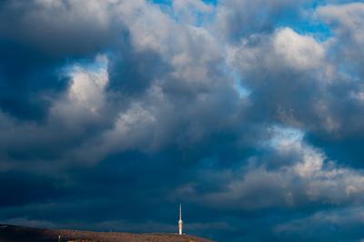 TV tower in Pecs, Hungary with cloudy sky-stock-foto