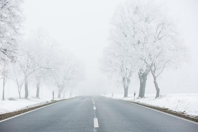 winter warning sign with snow-stock-photo