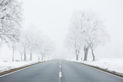 winter warning sign with snow-stock-photo