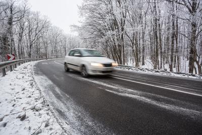 fast car with snowy road at  wintertime-stock-photo