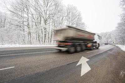 snowy road at cold wintertime-stock-photo