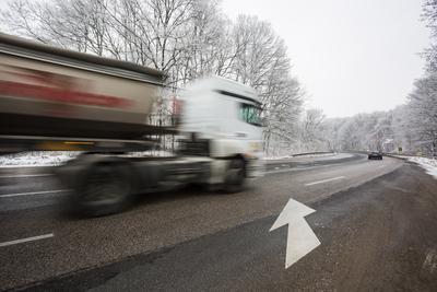 snowy road at cold wintertime-stock-photo