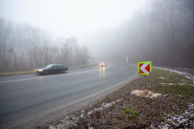 Moving car on highway with fog-stock-foto