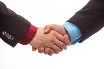 Business handshake in isolated white-stock-foto