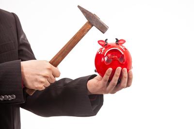 businessman break his red piggybank-stock-foto