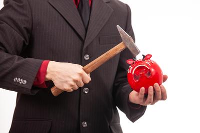 businessman break his red piggybank-stock-foto