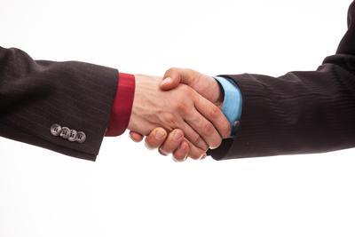 Business handshake in isolated white-stock-foto