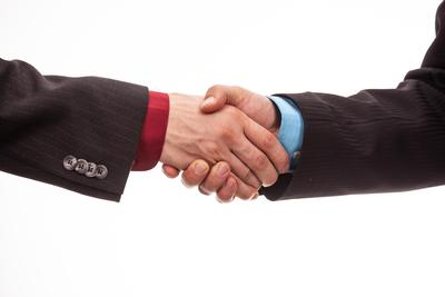 Business handshake in isolated white-stock-photo