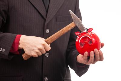 businessman break his red piggybank-stock-foto