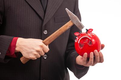 businessman break his red piggybank-stock-foto