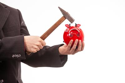 businessman break his red piggybank-stock-foto