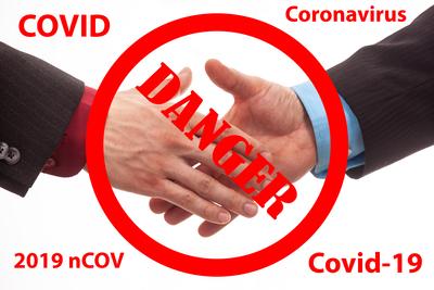 Business handshake in isolated white with coronavirus text-stock-photo