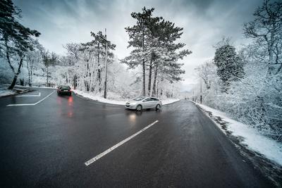 Snowy road with dramatic sky-stock-photo