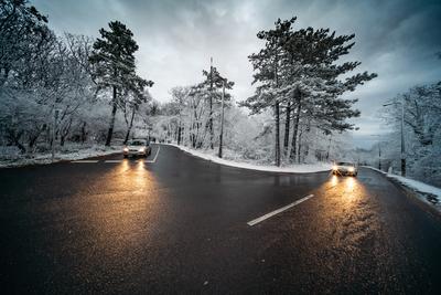 Snowy road with dramatic sky-stock-photo