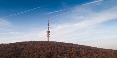 TV tower in Pecs Hungary with Mecsek hills-stock-foto
