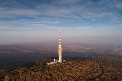 TV tower in Pecs Hungary with Mecsek hills-stock-foto