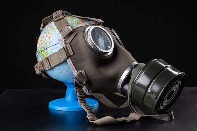 gas mask on a globe for coronavirus protection-stock-photo