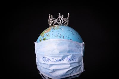 medical mask on a globe for coronavirus protection-stock-photo