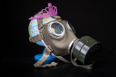 gas mask on a globe for coronavirus protection-stock-photo