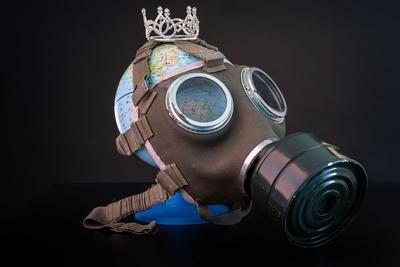 gas mask on a globe for coronavirus protection-stock-photo