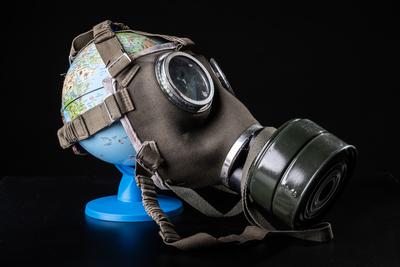 gas mask on a globe for coronavirus protection-stock-photo