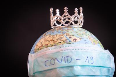 medical mask on a globe for coronavirus protection-stock-photo