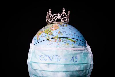 medical mask on a globe for coronavirus protection-stock-photo