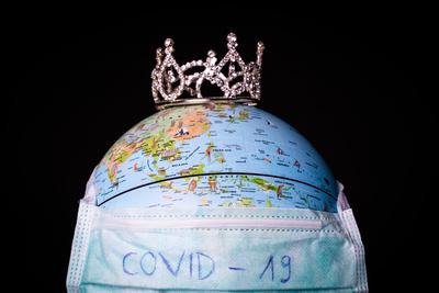 medical mask on a globe for coronavirus protection-stock-photo