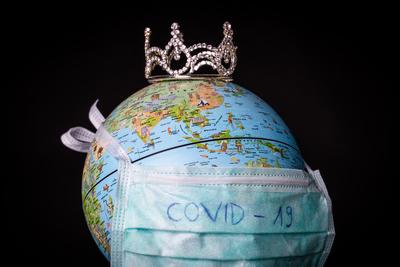 medical mask on a globe for coronavirus protection-stock-photo