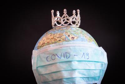 medical mask on a globe for coronavirus protection-stock-photo