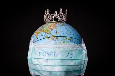 medical mask on a globe for coronavirus protection-stock-photo