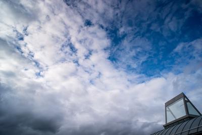 roof windows on a modern building  with cloudy sky-stock-photo