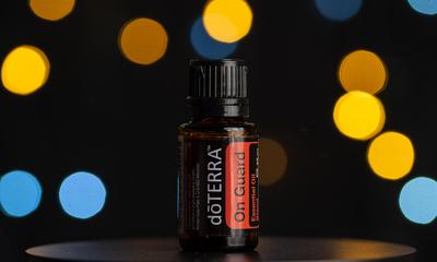 Pecs / Hungray - July 02 2020 - Illustrative editorial image of On guard Doterra Essential Oil for everyday use on a dark shiny background-stock-photo