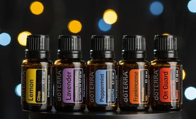 Pecs / Hungray - July 02 2020 - Illustrative editorial image of Doterra Essential Oils for everyday use on a dark shiny background-stock-photo