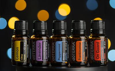 Pecs / Hungray - July 02 2020 - Illustrative editorial image of Doterra Essential Oils for everyday use on a dark shiny background-stock-photo