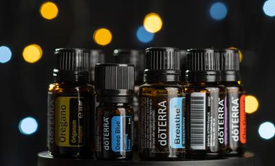 Pecs / Hungray - July 02 2020 - Illustrative editorial image of Doterra Essential Oils for everyday use on a dark shiny background-stock-photo