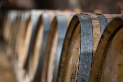 wooden barrels in old winery-stock-foto