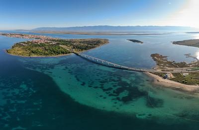 Aerial view of bridge to island Vir over the Adriatic sea in Croatia-stock-photo