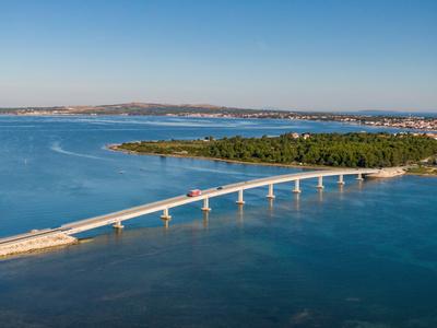 Aerial view of bridge to island Vir over the Adriatic sea in Croatia-stock-photo