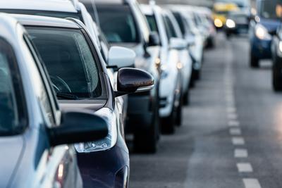 Many cars travelling on a road-stock-photo