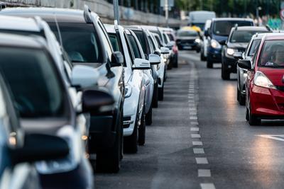 Many cars travelling on a road-stock-photo