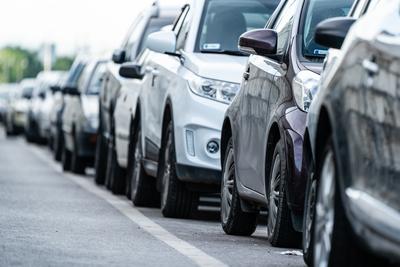 Many cars travelling on a road-stock-photo