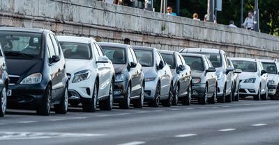 Many cars travelling on a road-stock-photo