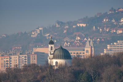 Small chapel in Pecs, Hungary with block houses-stock-photo