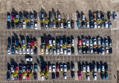 Aerial drone view above cars at parking-stock-foto