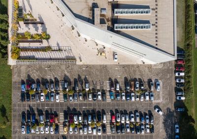Aerial drone view above cars at parking-stock-foto